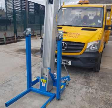 Genie Lift SLA15 with fork extensions (if required).